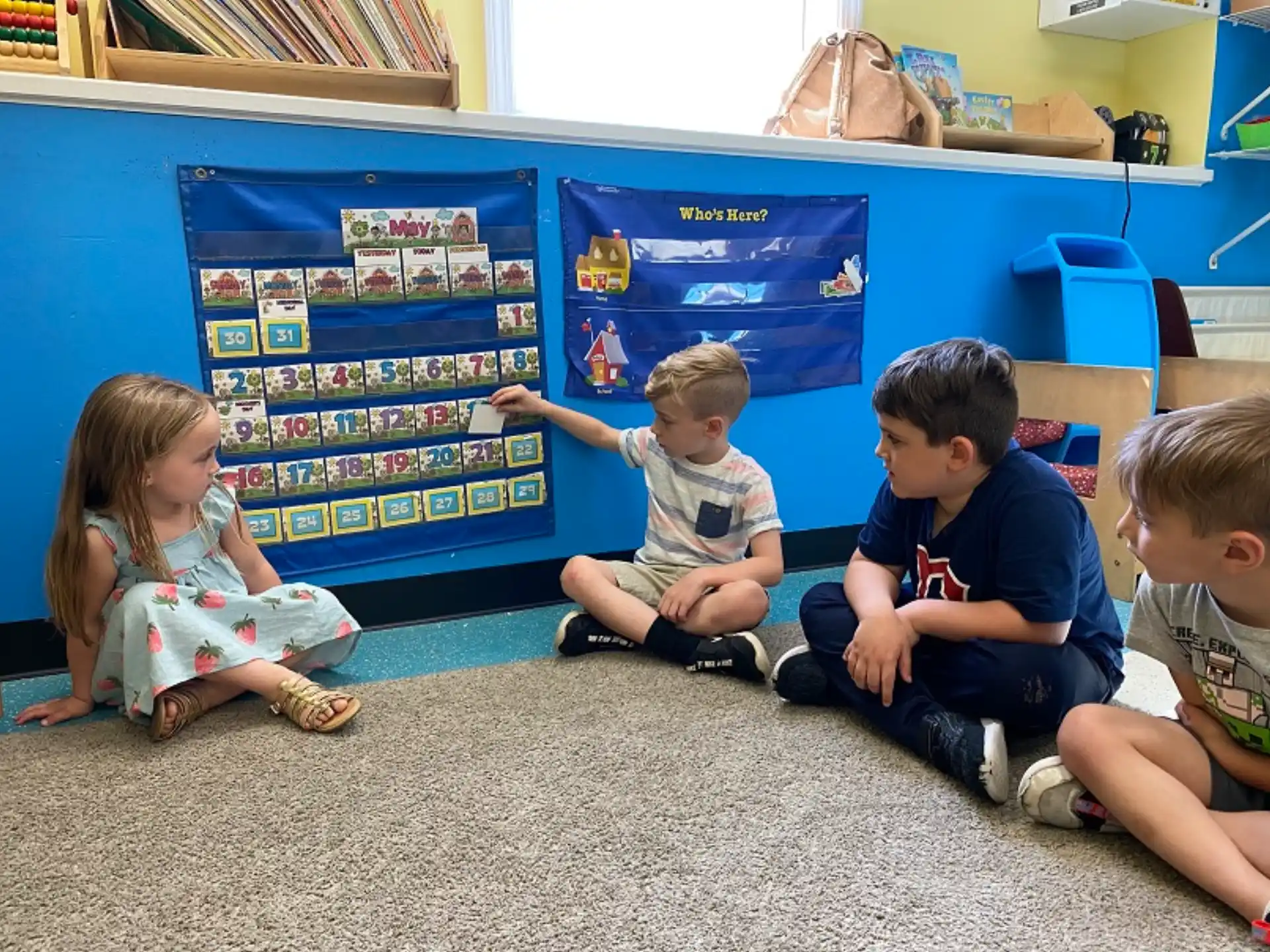 a group of children sitting on the floor