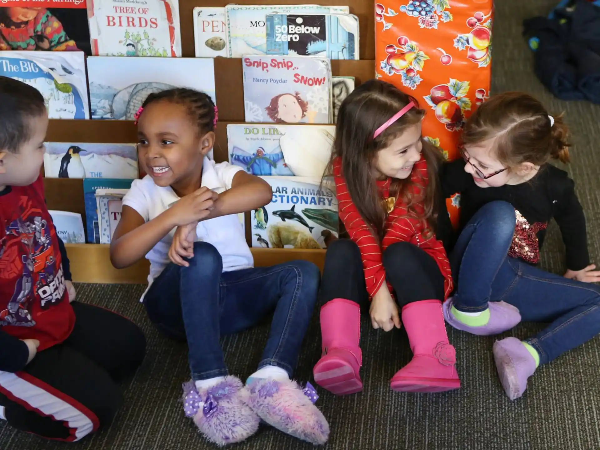 a group of children sitting on the floor