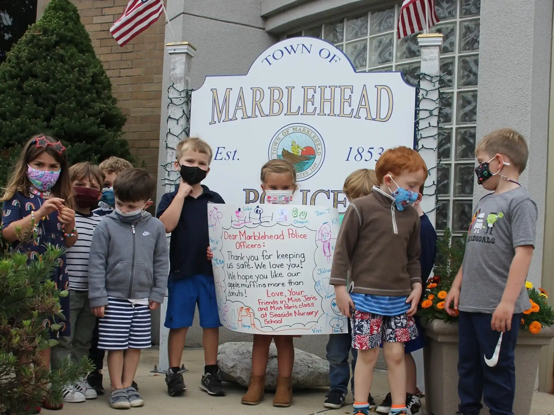 a group of people holding a sign