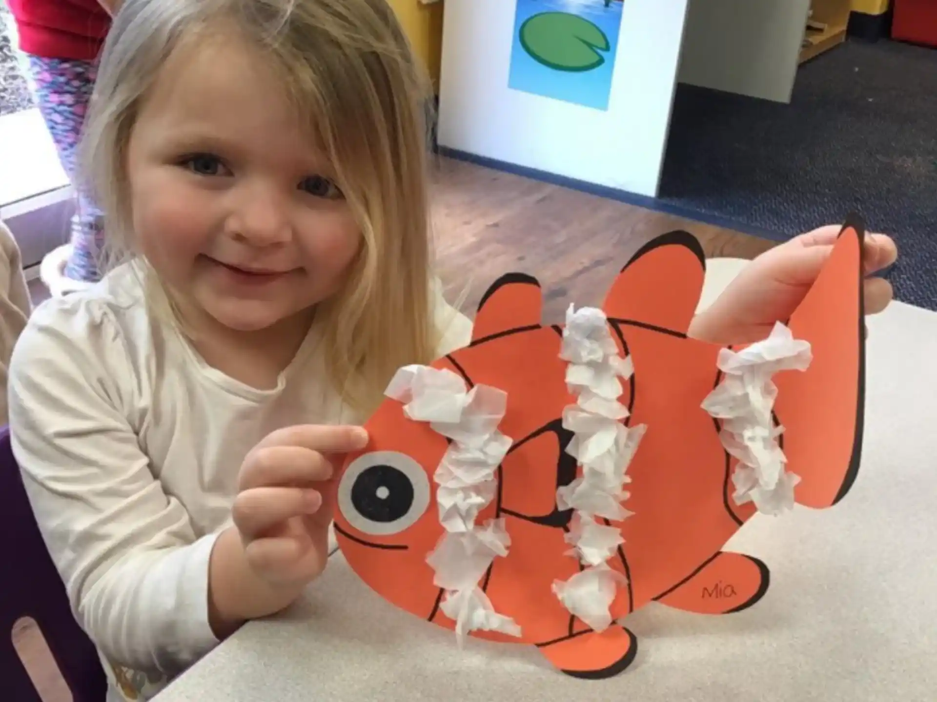 a girl holding a toy