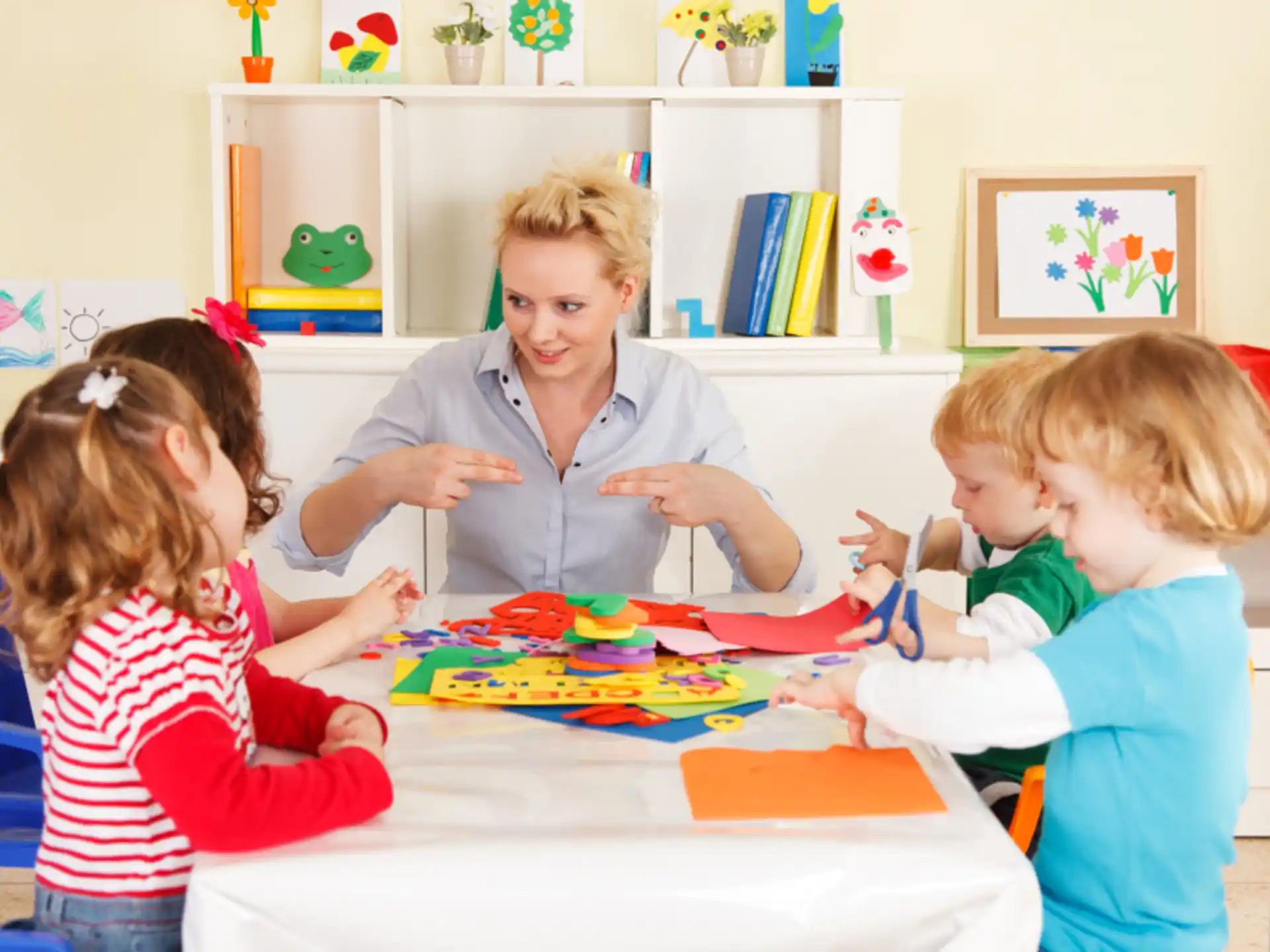 a group of children sitting at a table