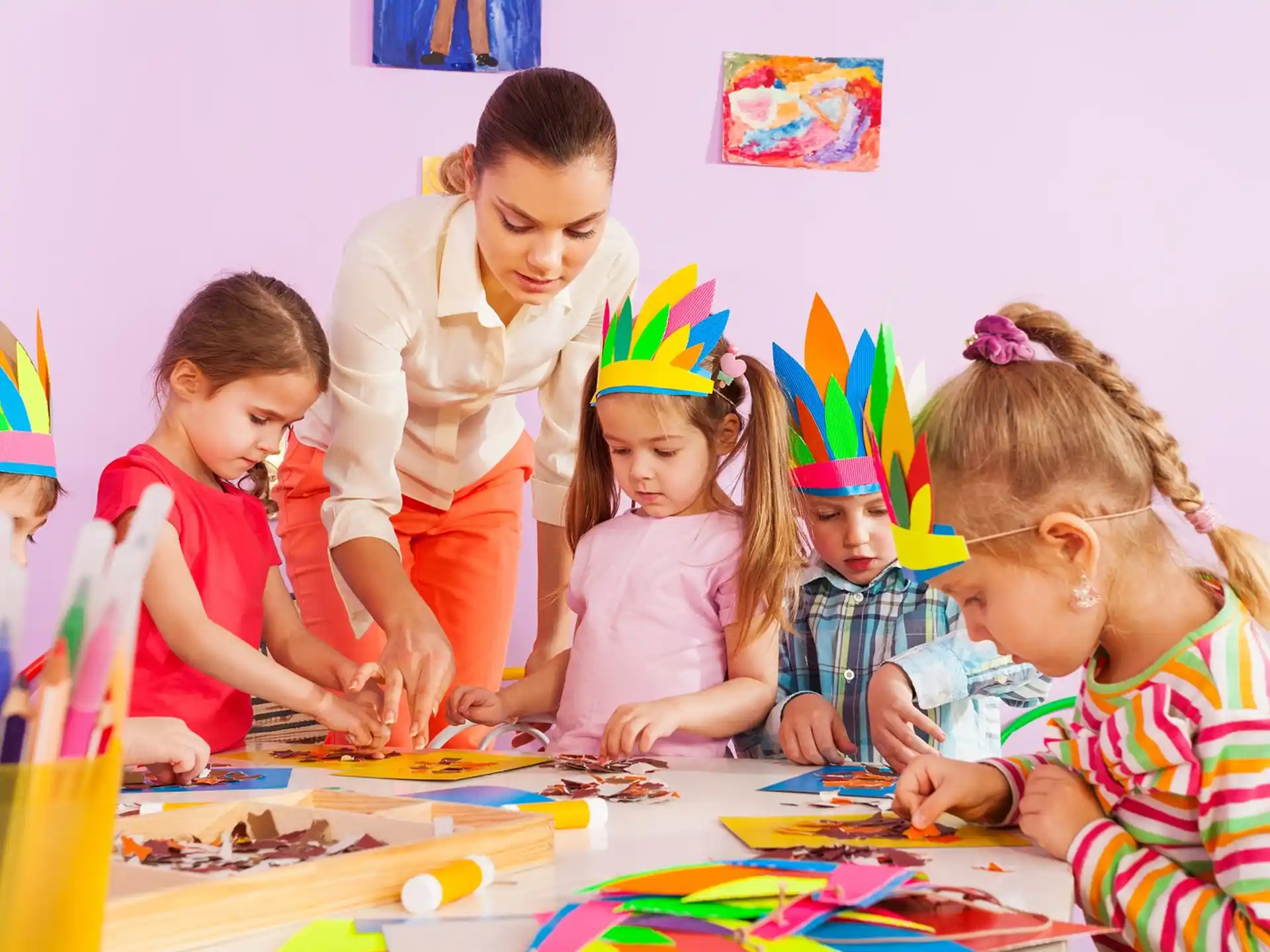 a group of children wearing party hats