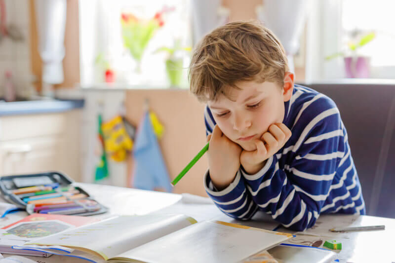 a boy sitting at a table
