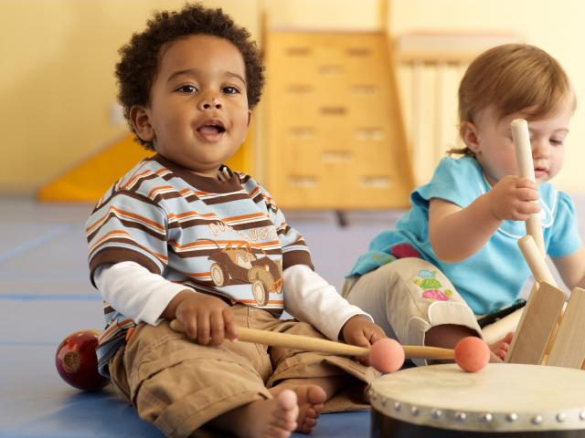 a couple of kids playing with a toy