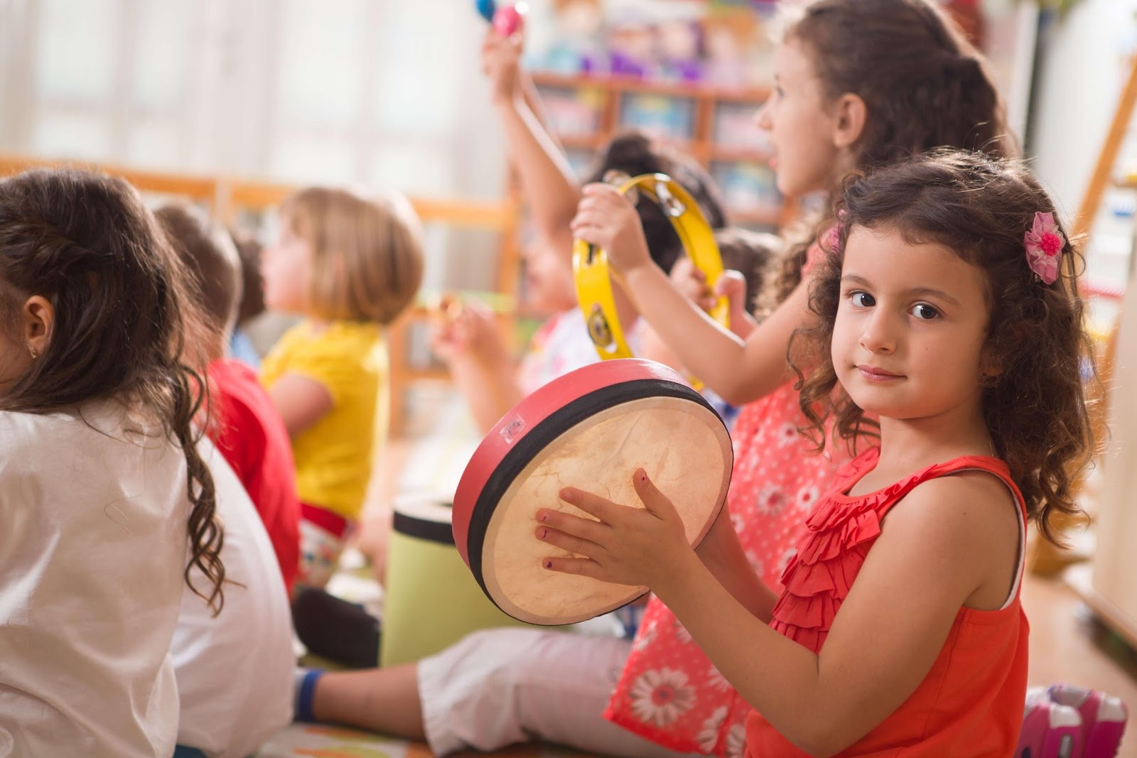 a group of young girls playing with a ball