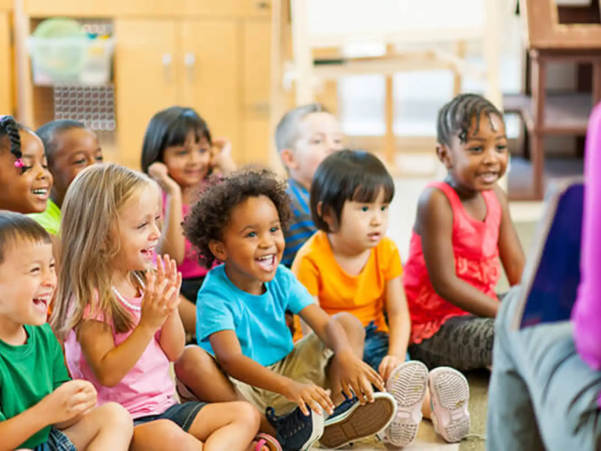 a group of children sitting on the floor