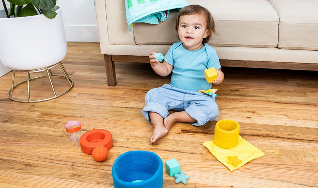 a baby sitting on the floor
