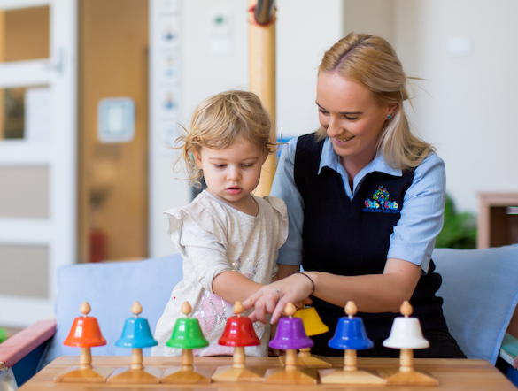 a person and a child playing chess