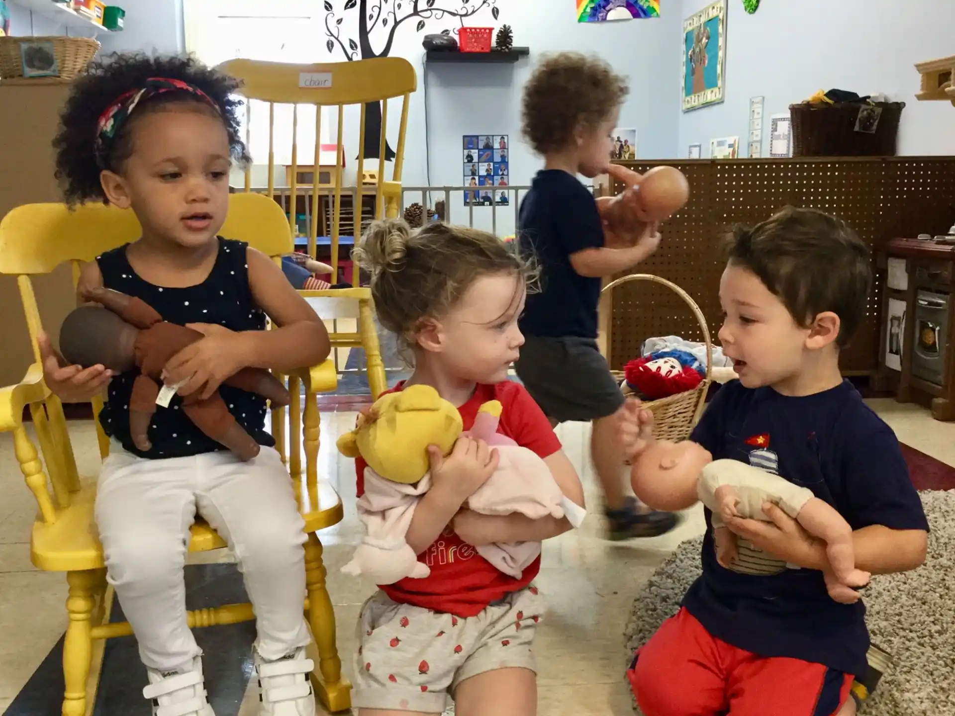 a group of children sitting in chairs