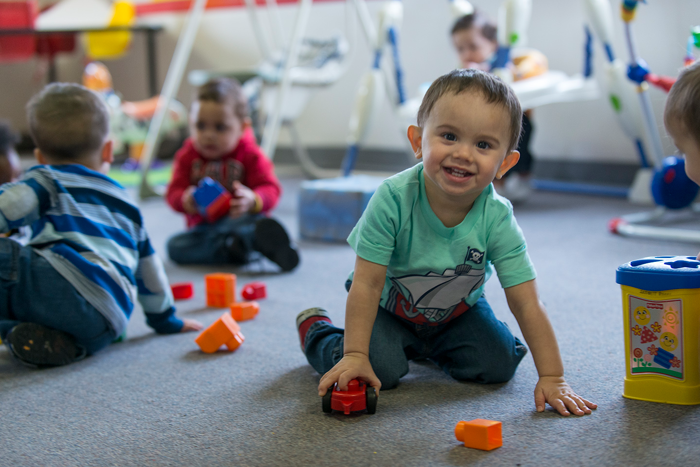 a group of children playing with toys