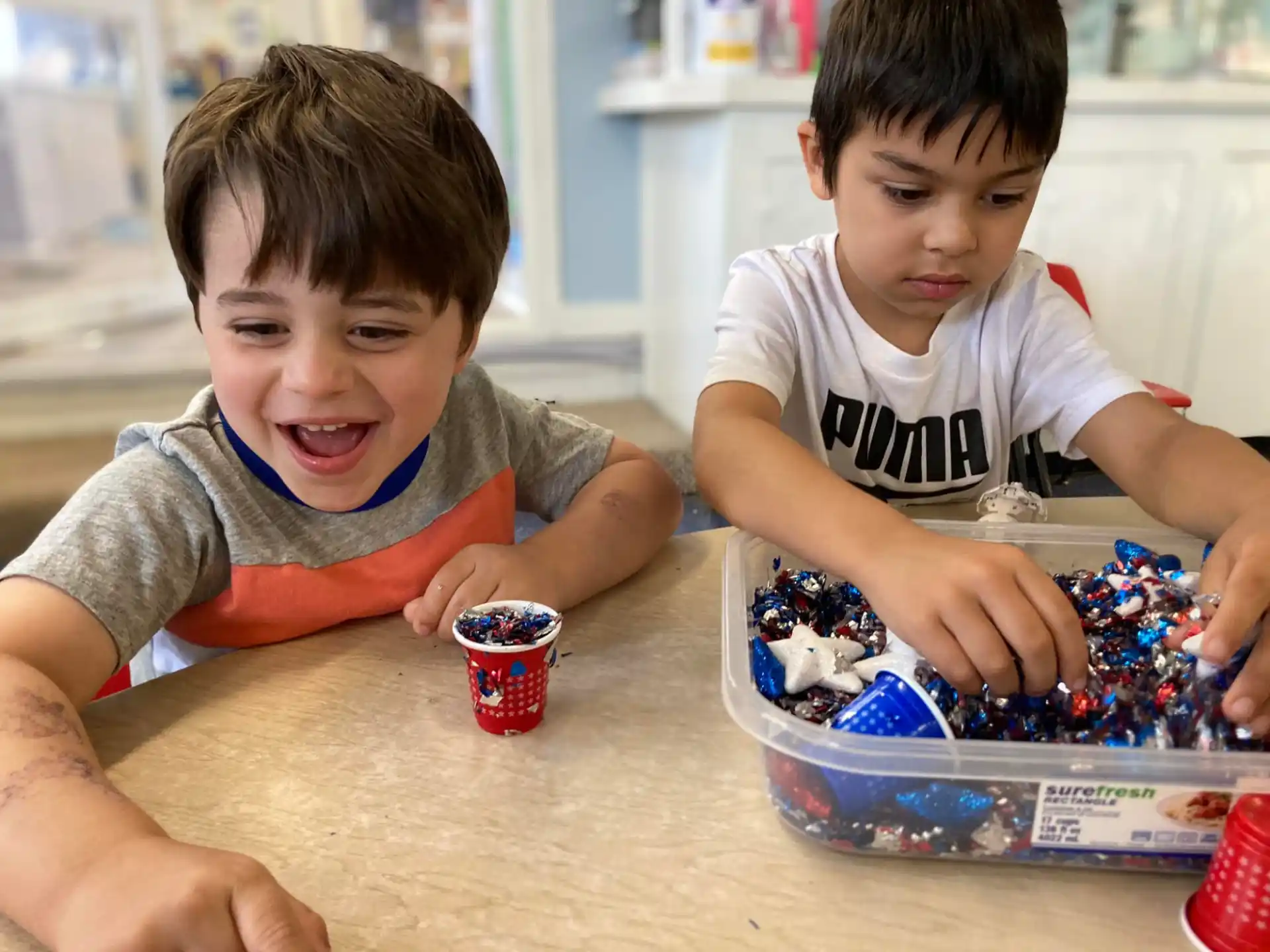 a couple of boys playing with a toy