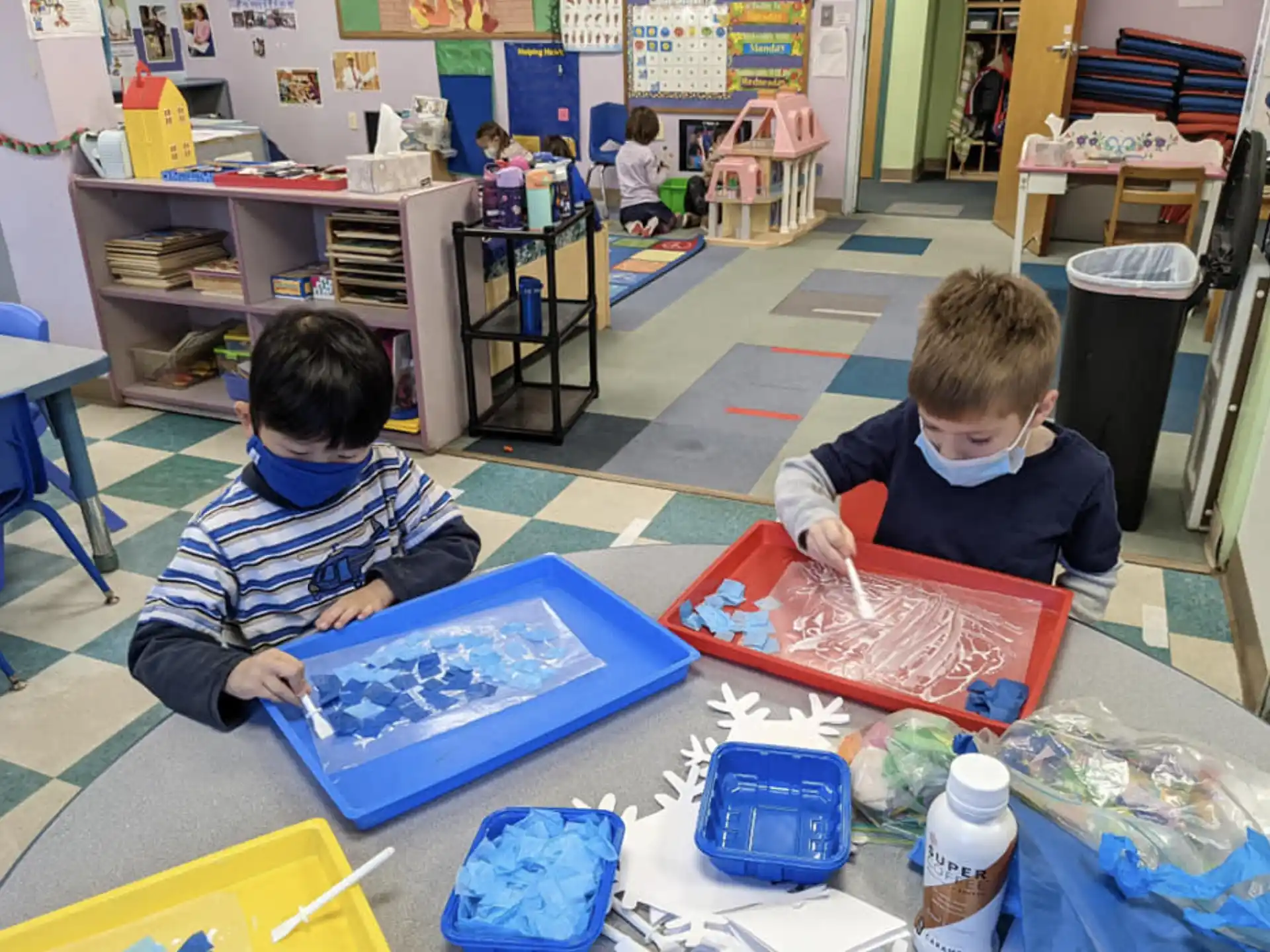 a few young boys in a classroom