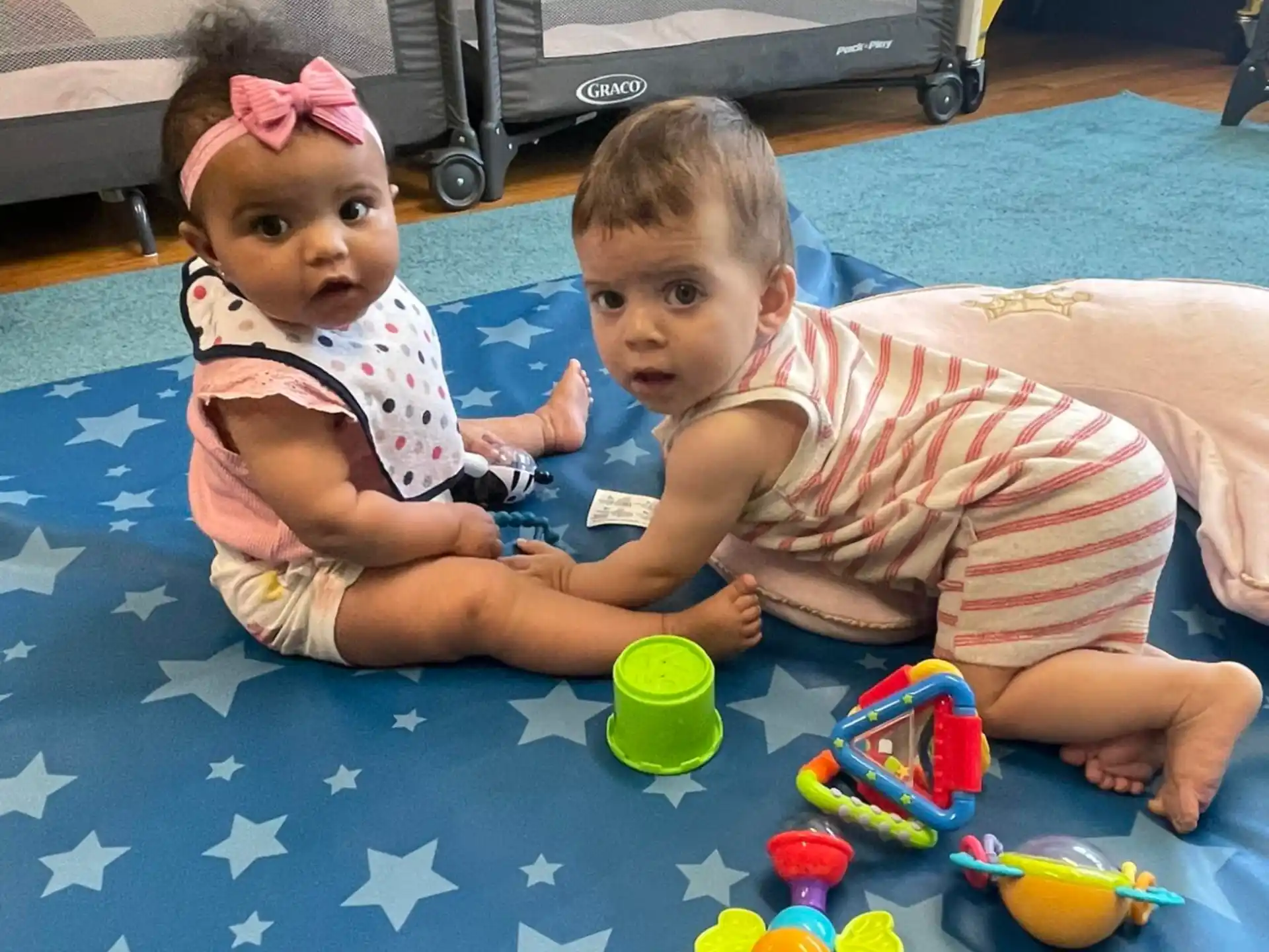 two children lying on the ground