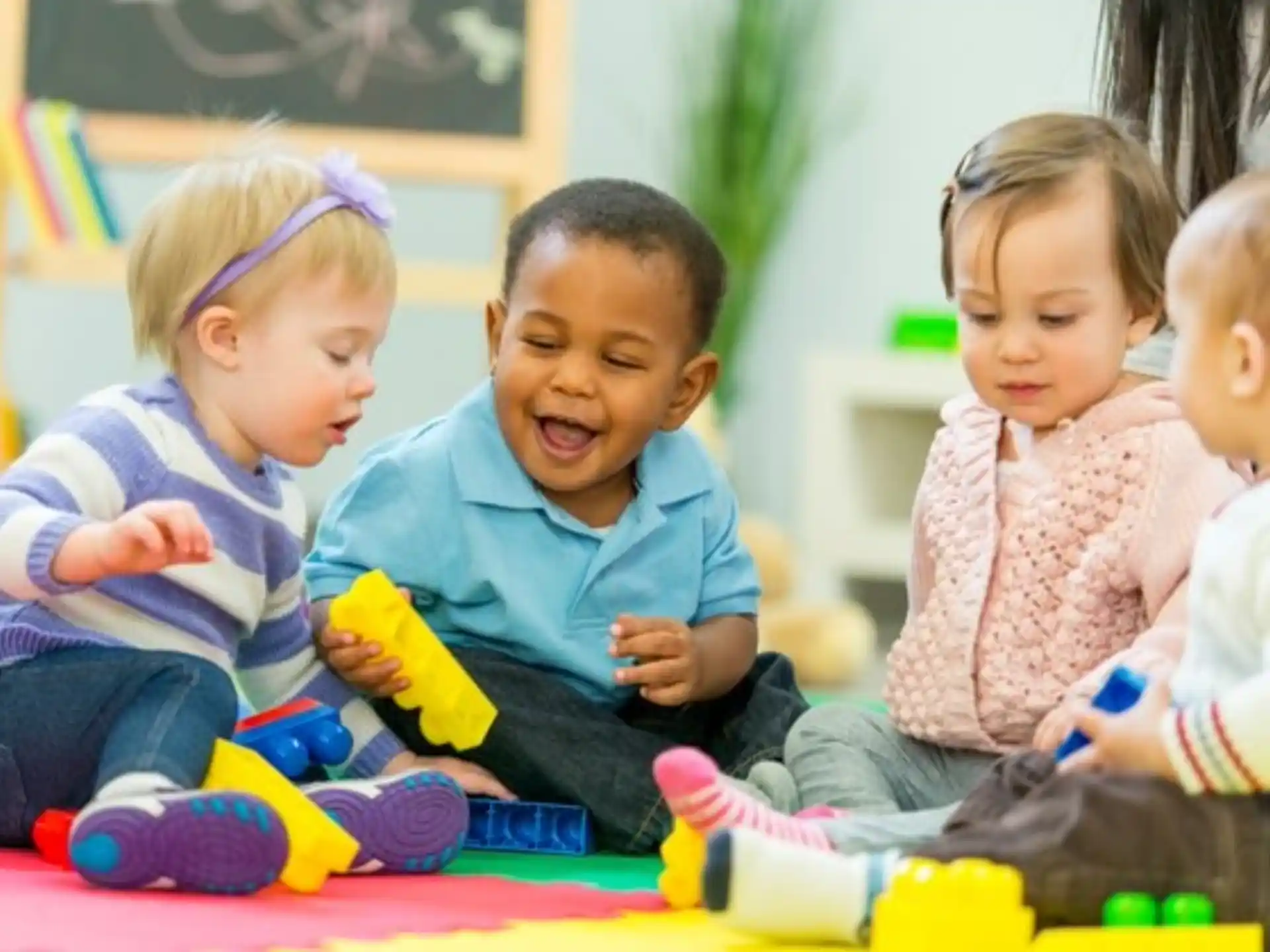 a group of children sitting on the floor