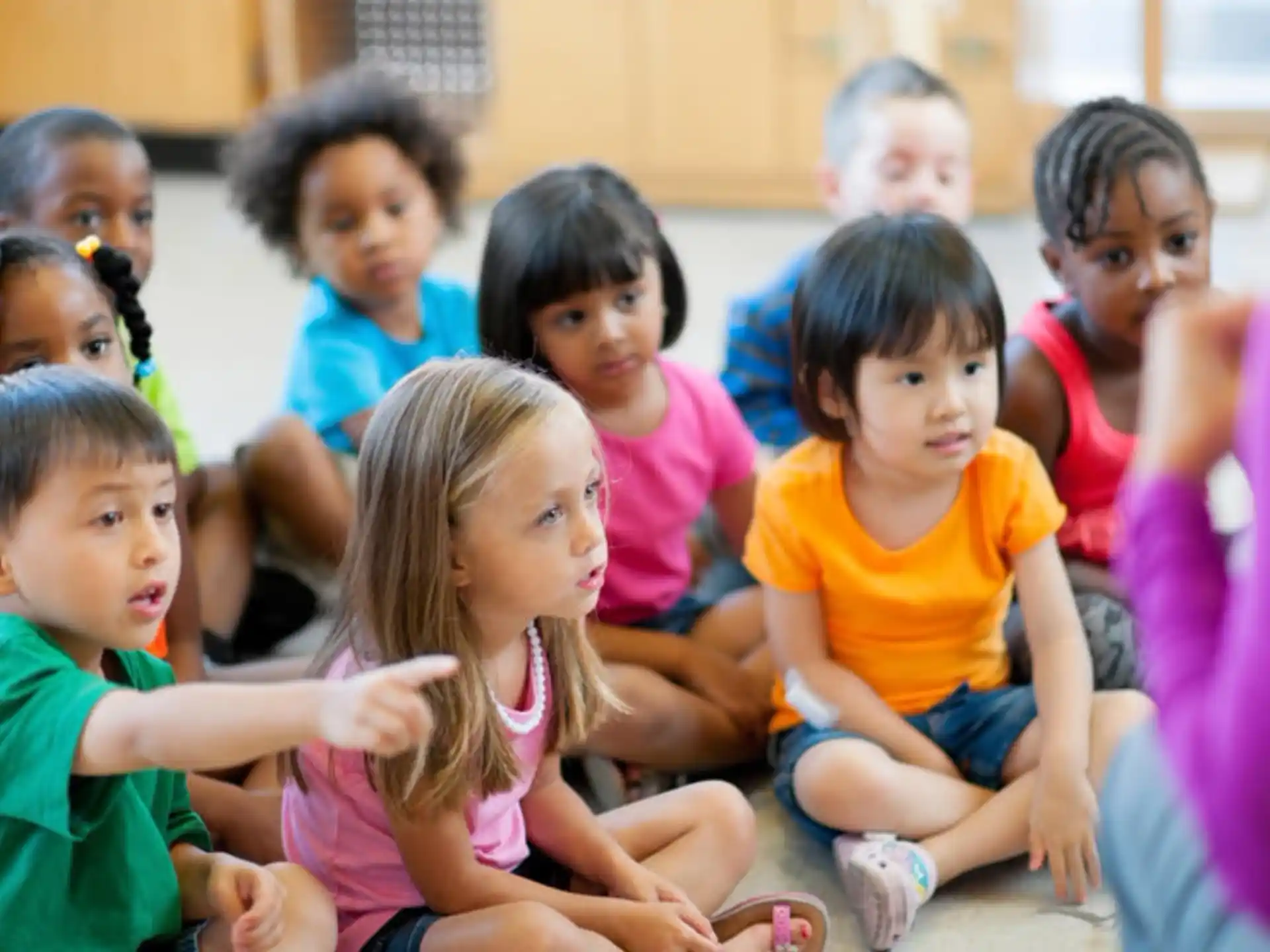 a group of children sitting on the floor
