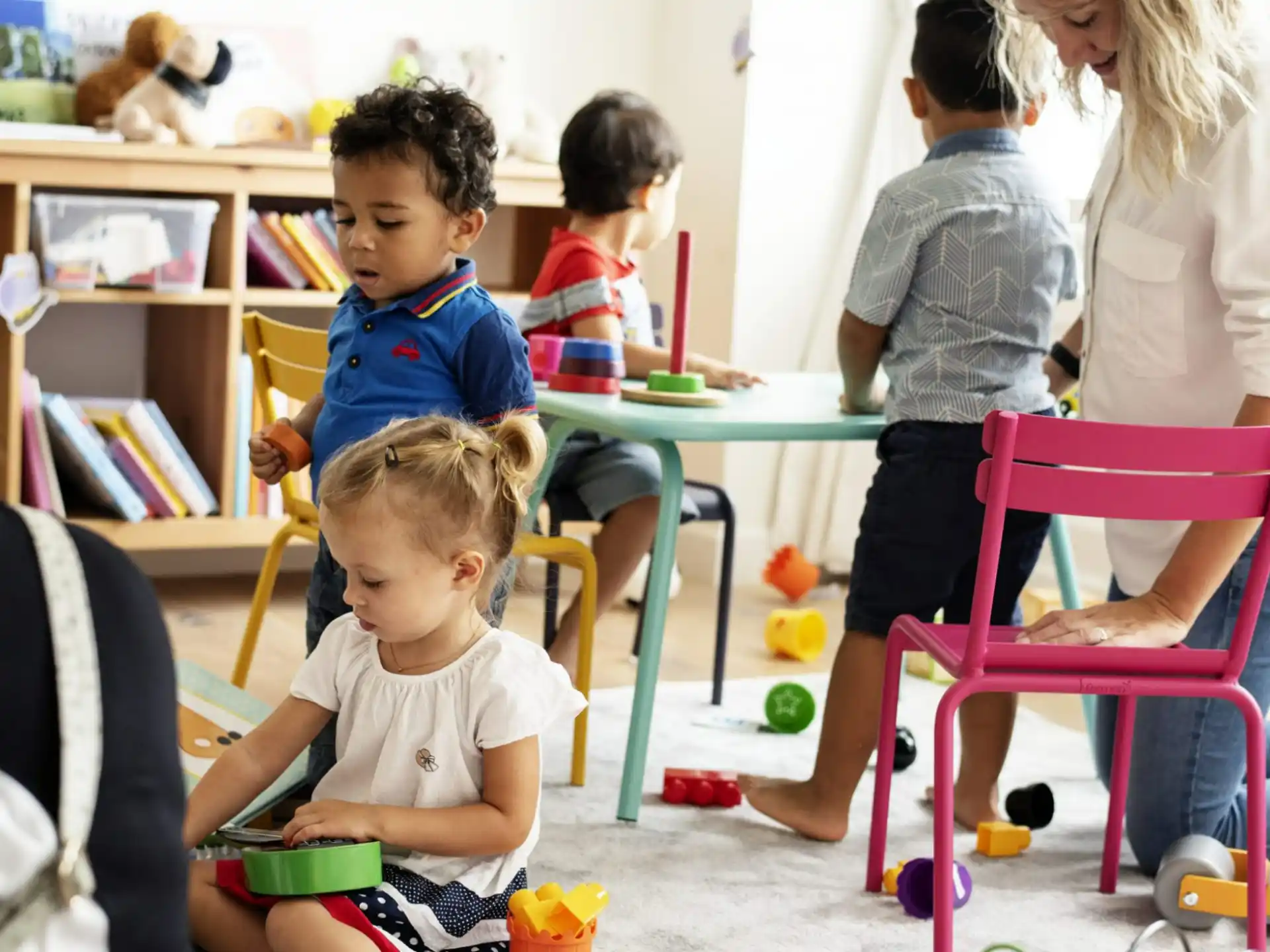 a group of children playing with toys
