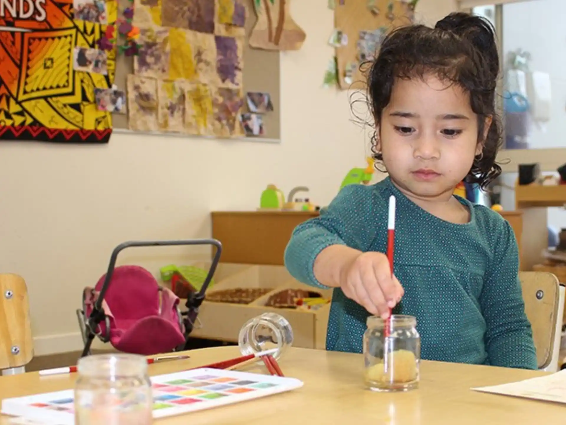 a child sitting at a table