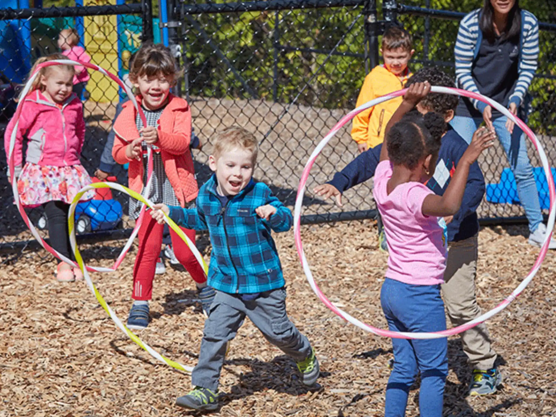 a group of children playing on a playground