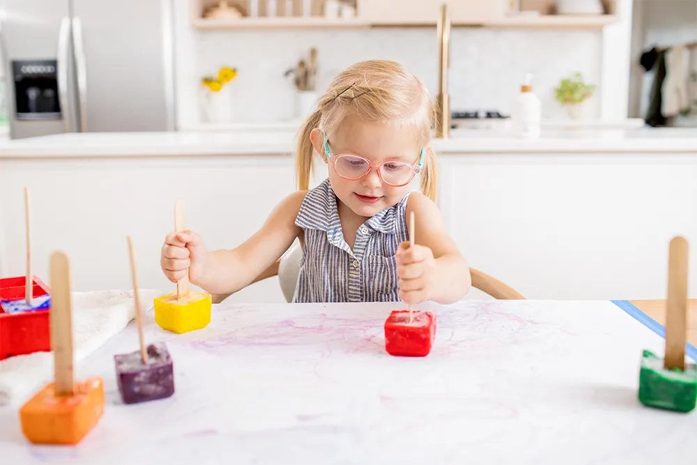 a child sitting at a table