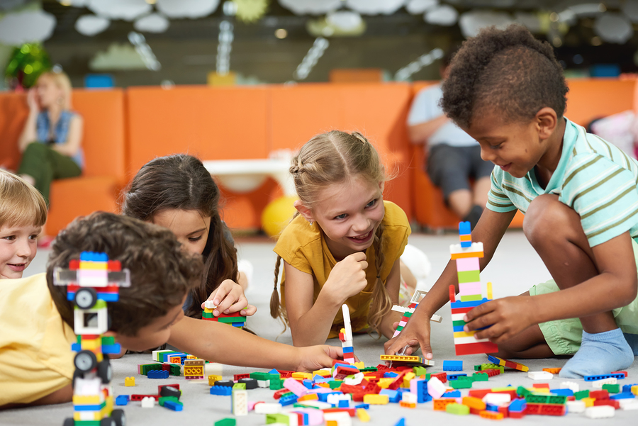 a group of children playing with toys