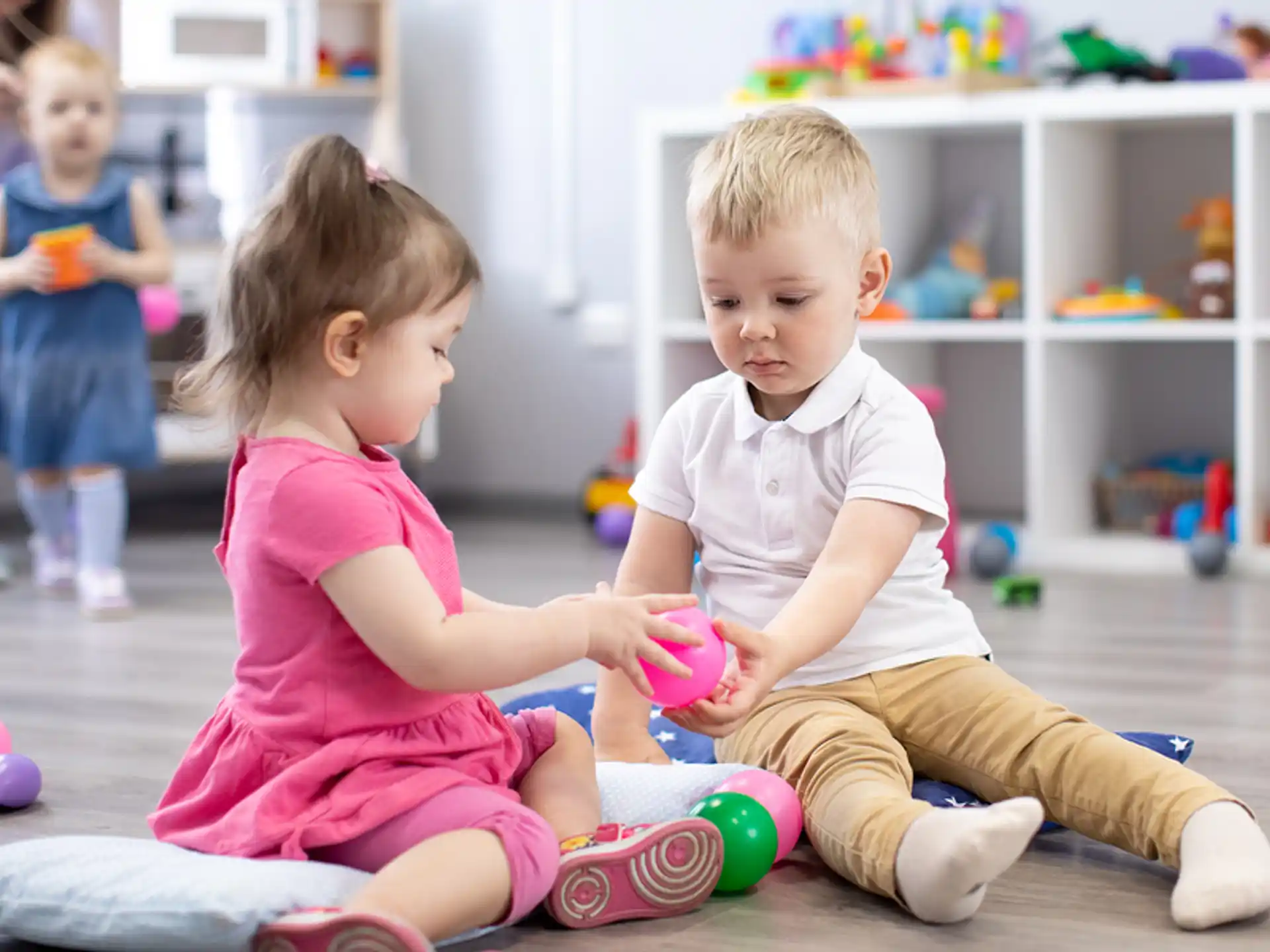 a couple of children playing with toys