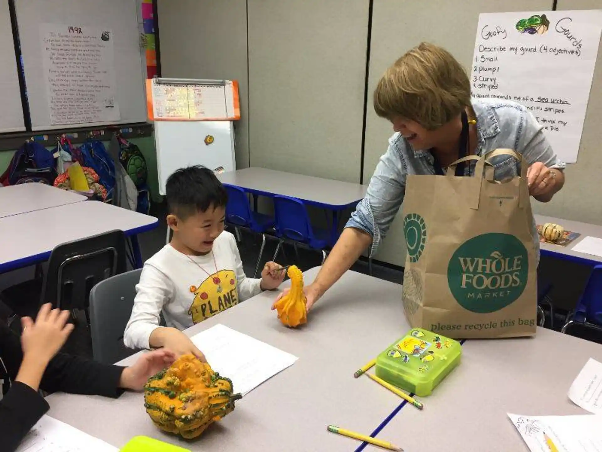 a person and a boy in a classroom