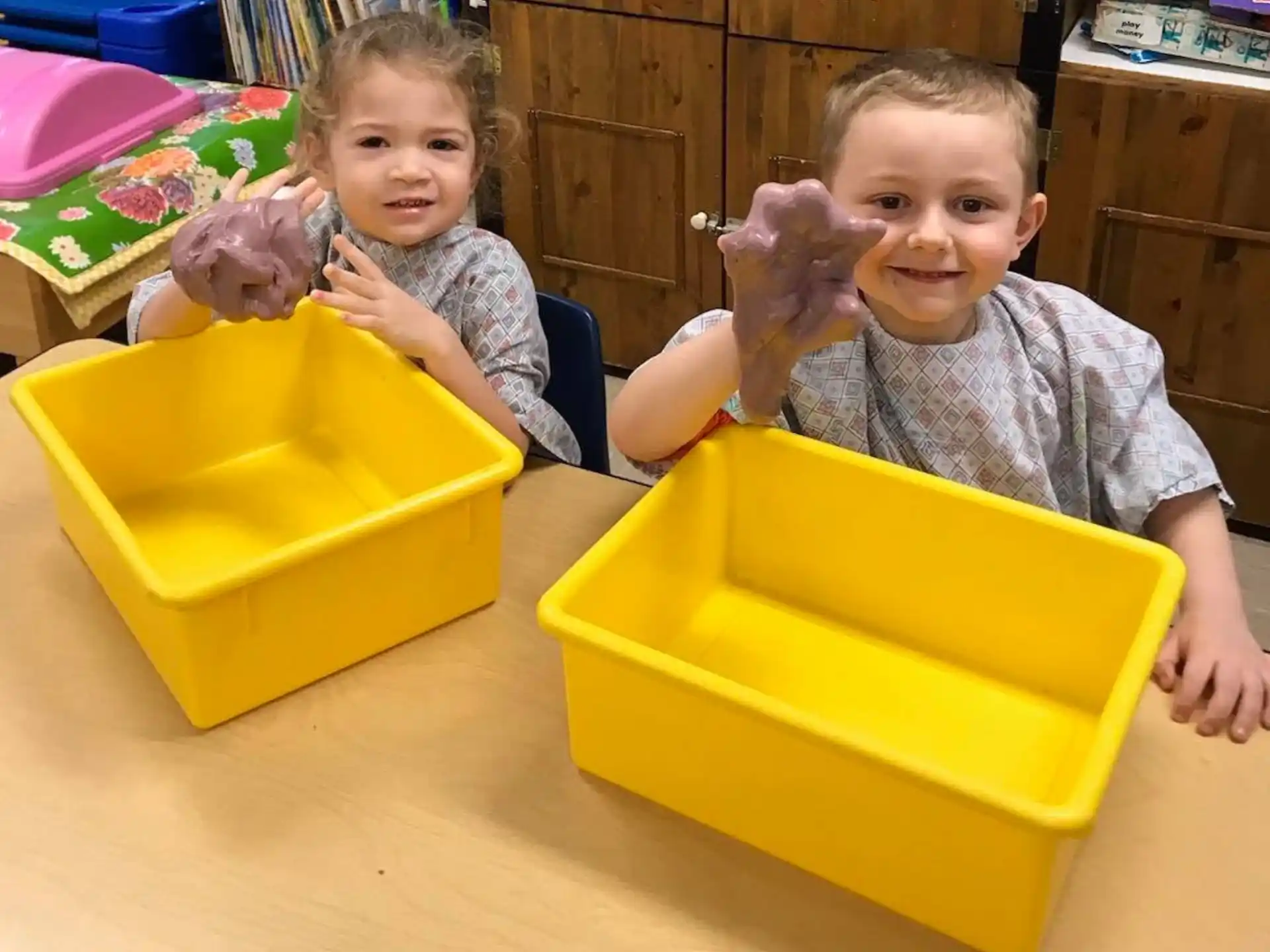 a couple of kids playing with toys