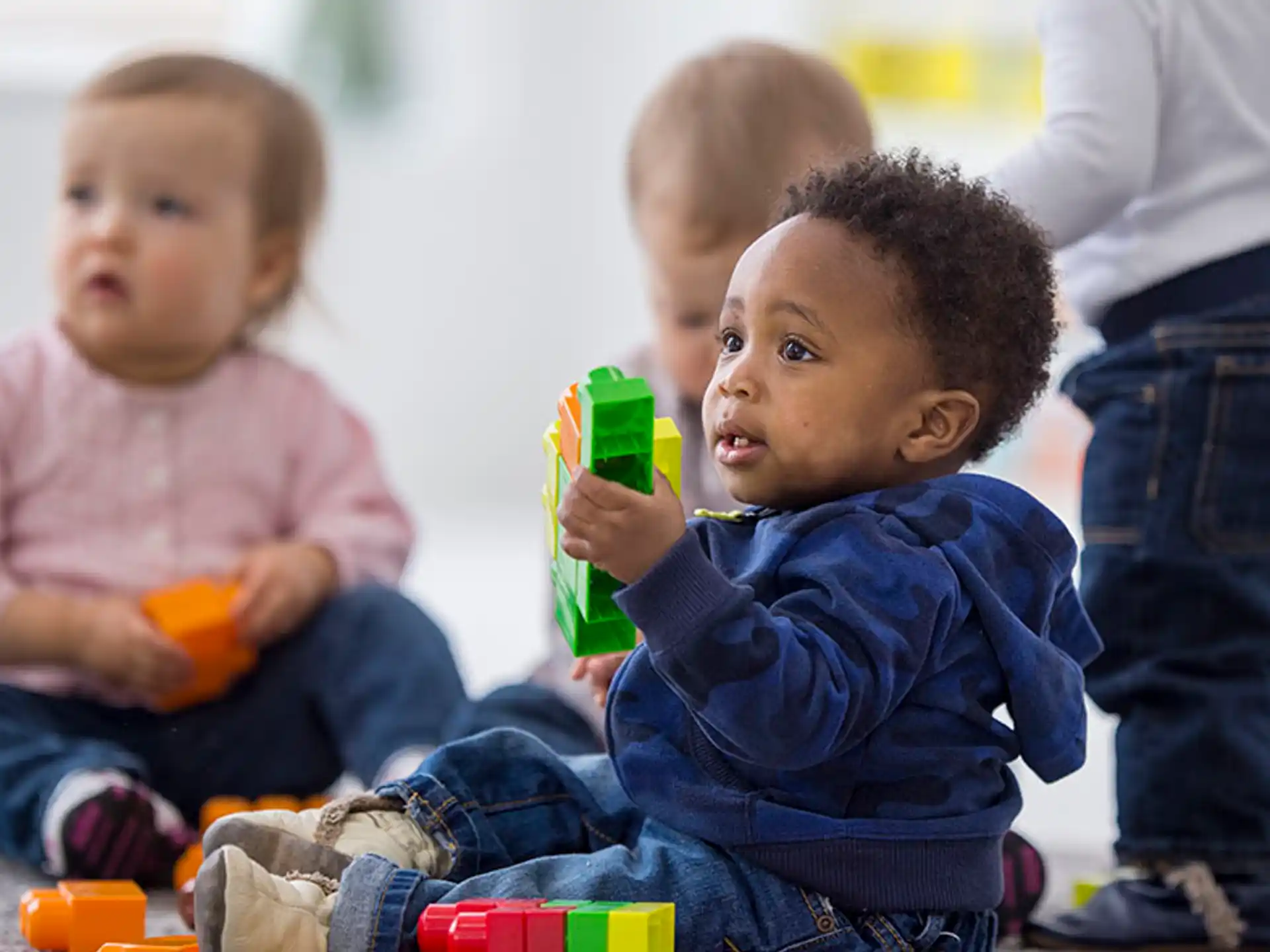 a group of children playing with toys
