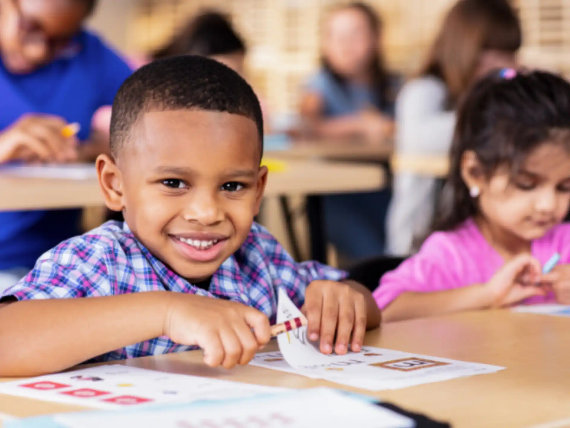 a few children sitting at a table