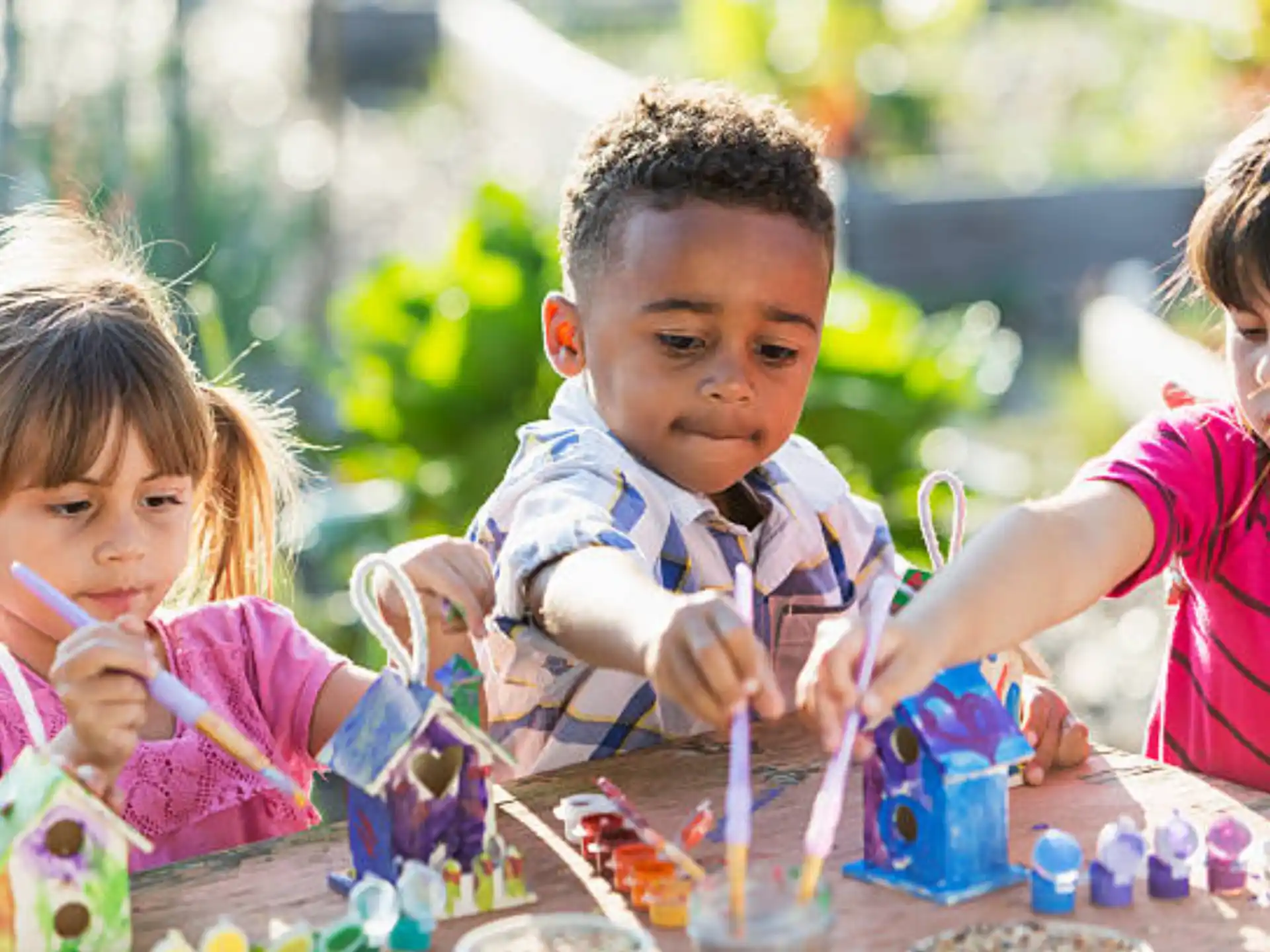 a group of children playing with toys