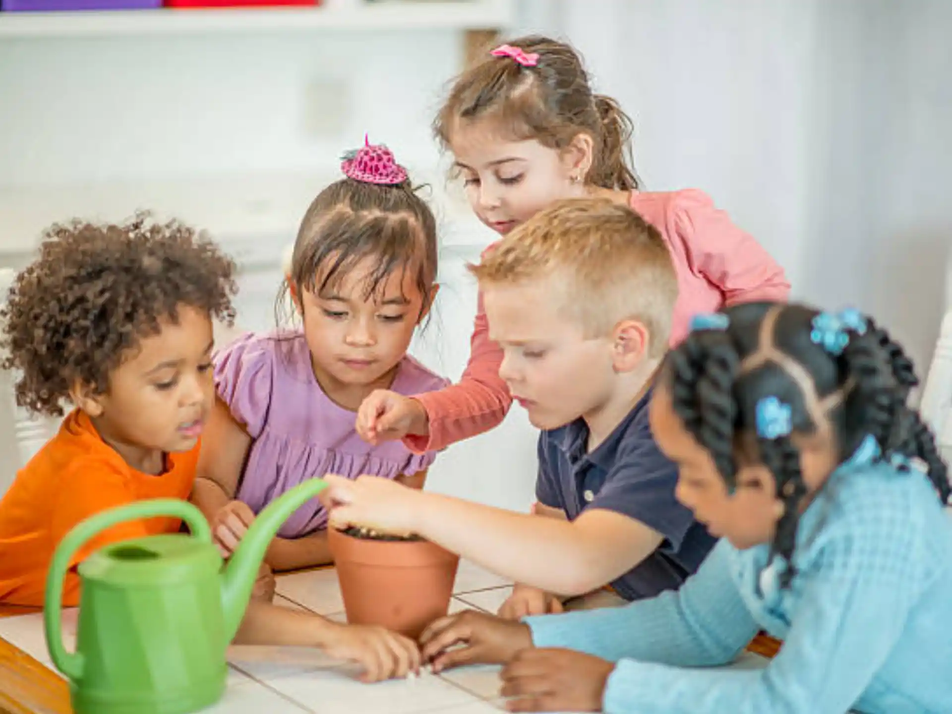 a group of children sitting at a table