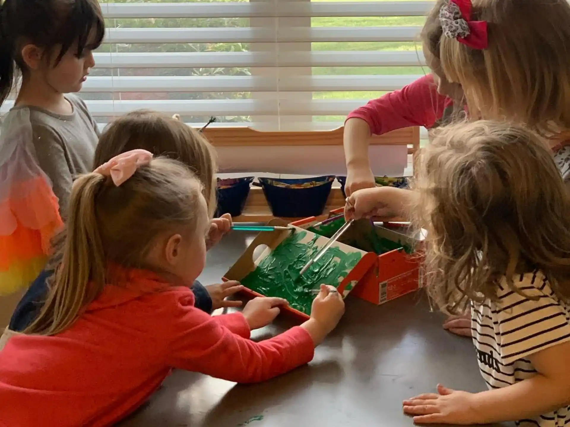 a group of children playing with toys