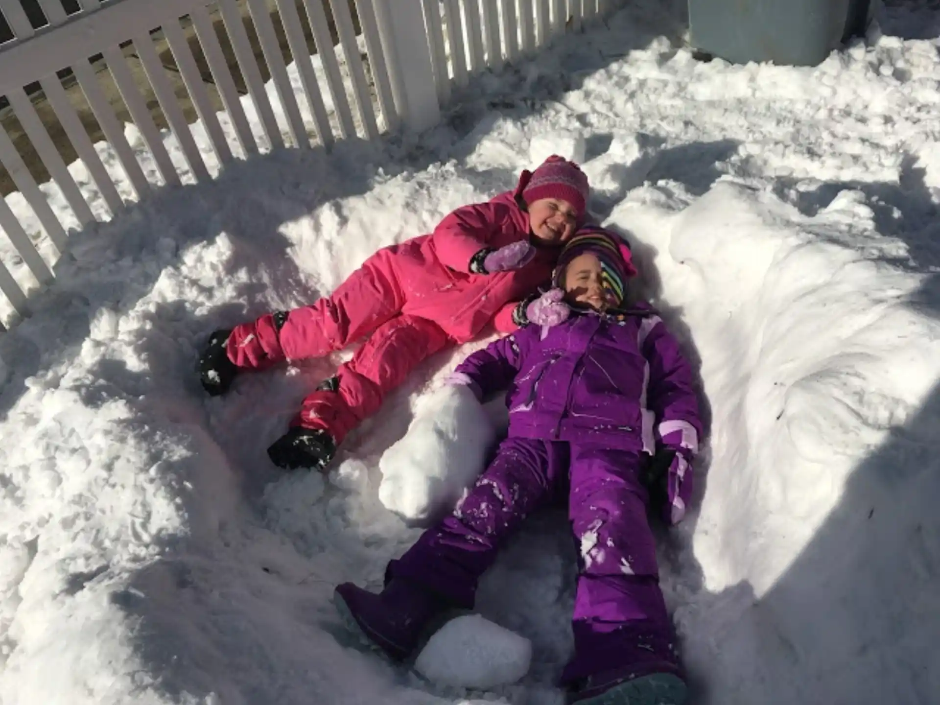a person and a child in the snow