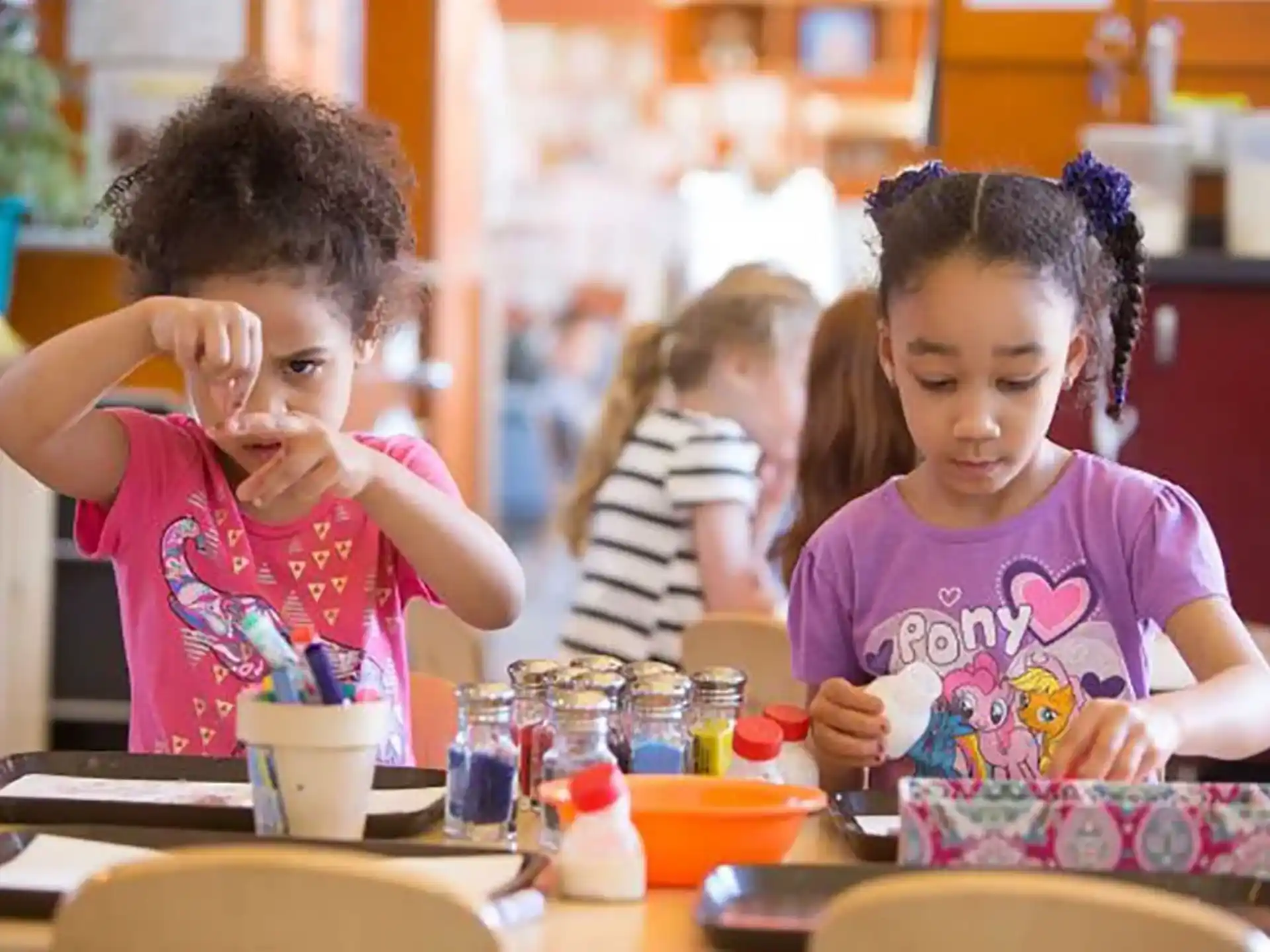 a few young girls painting
