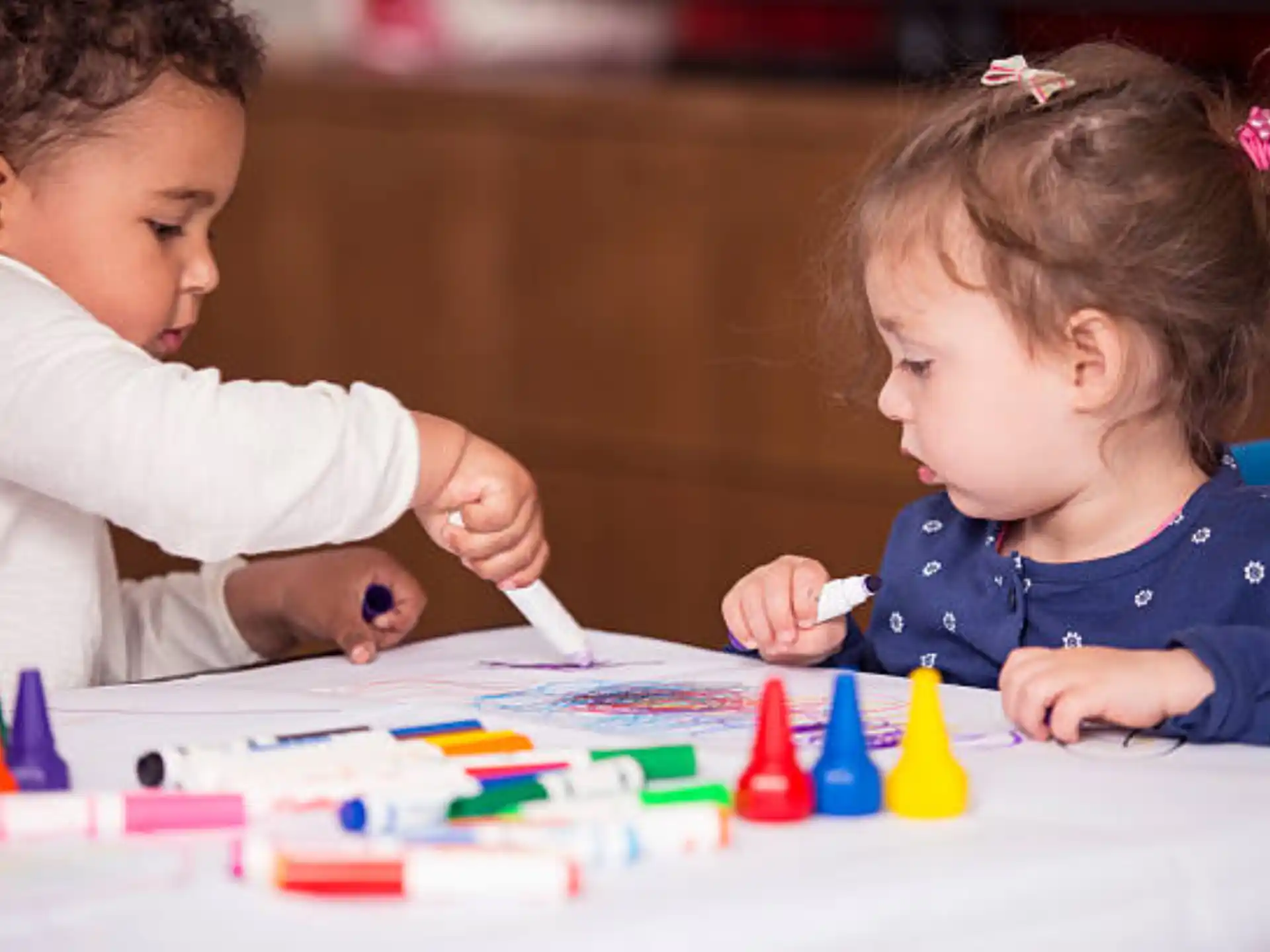 a couple of children playing with toys