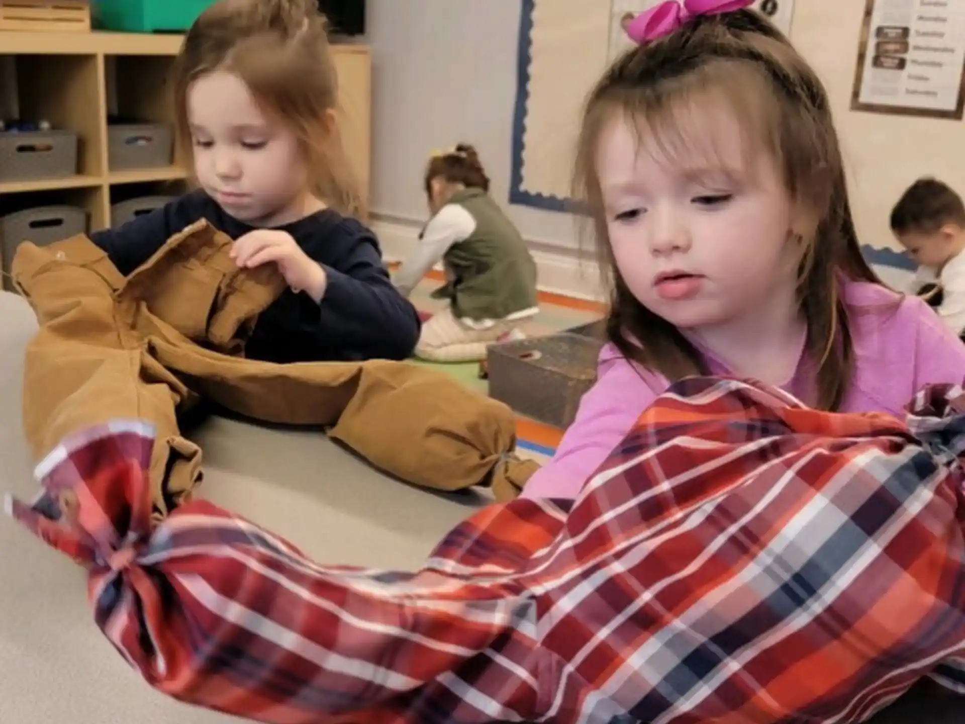 a group of children sitting in a classroom