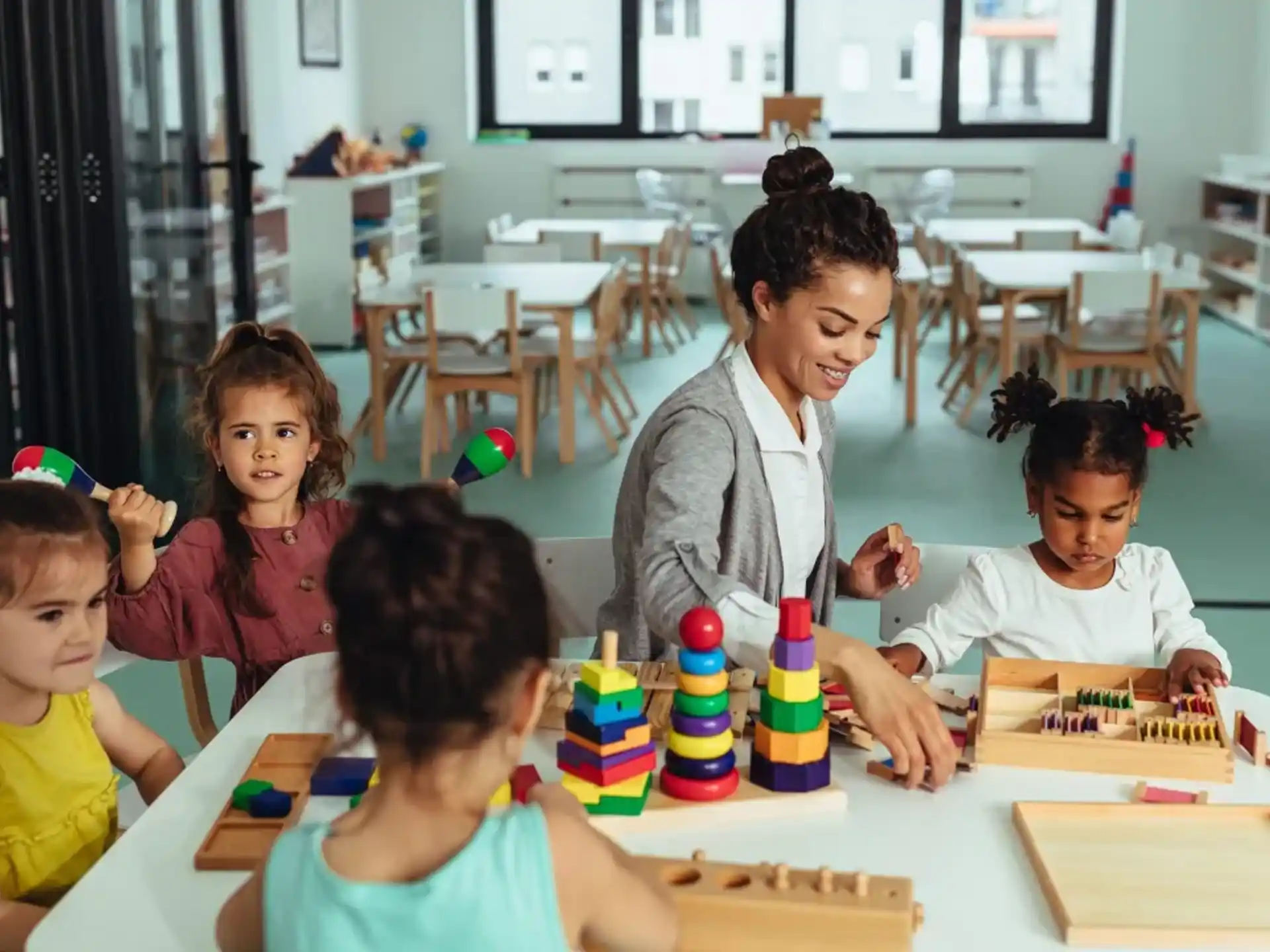 a person and several children playing a board game