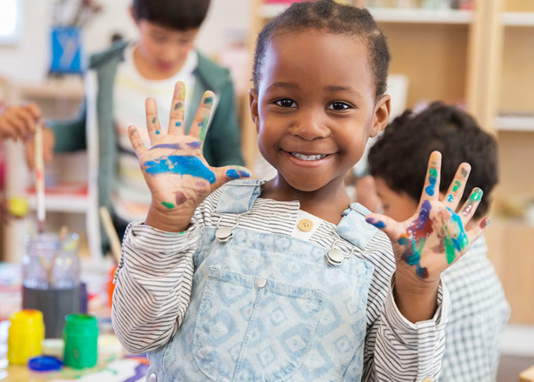 medium shot of a girl holding up her hands