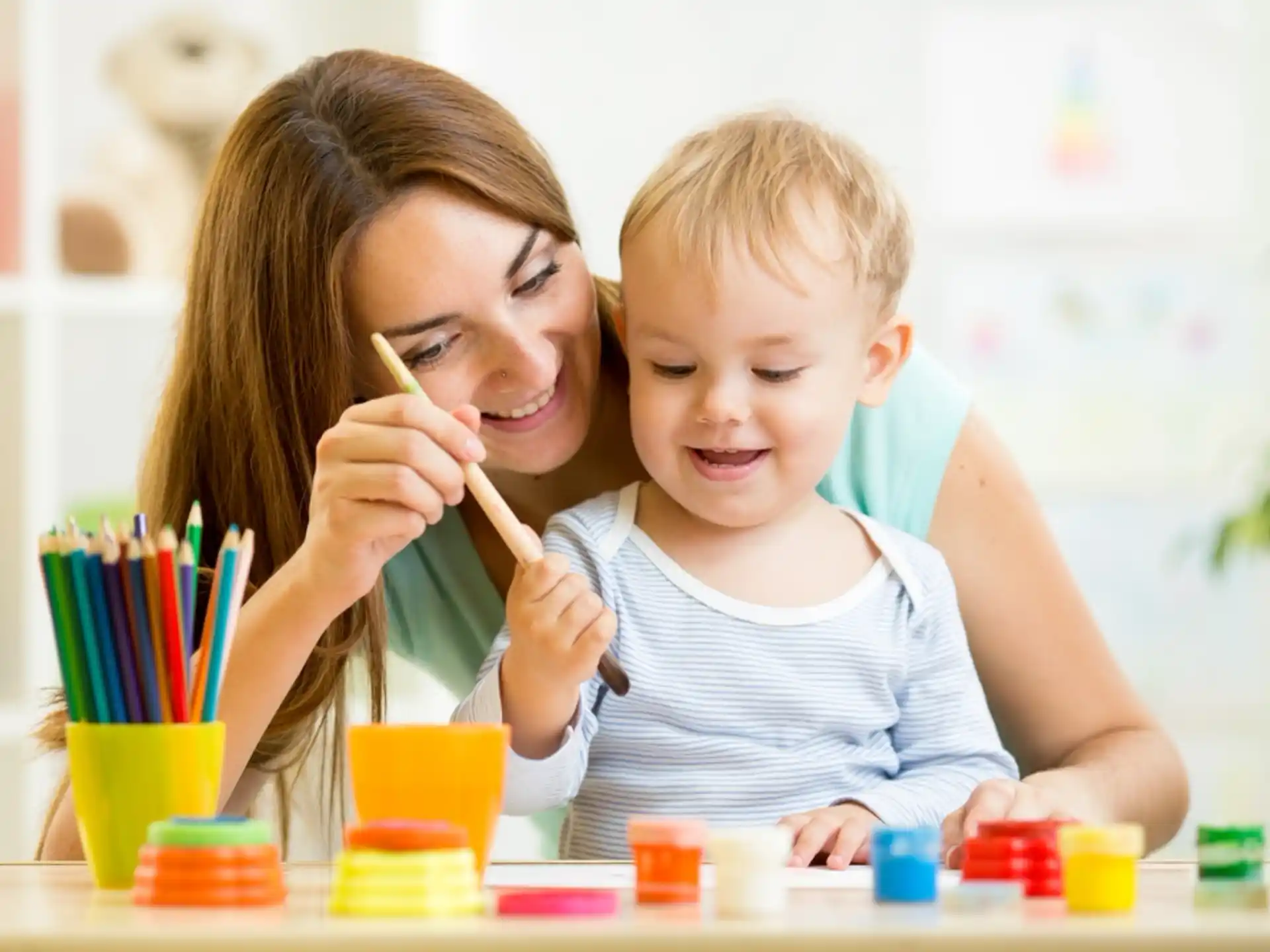 a person and a child painting