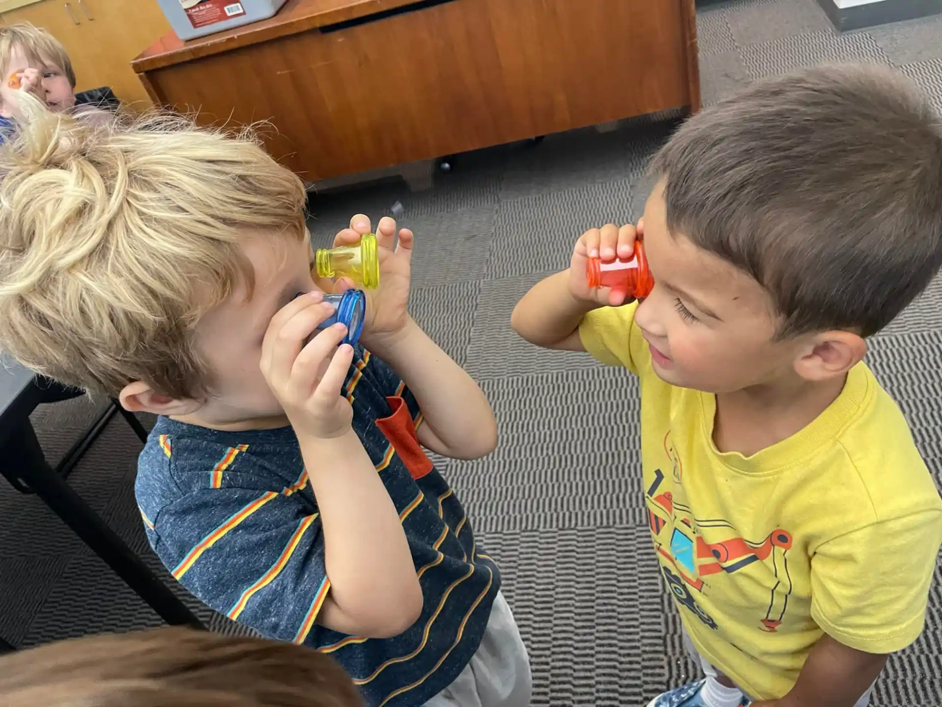 a couple of kids playing with toys