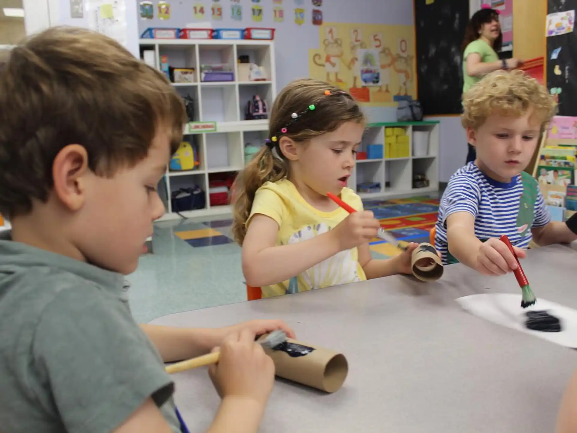 a group of children playing with a toy