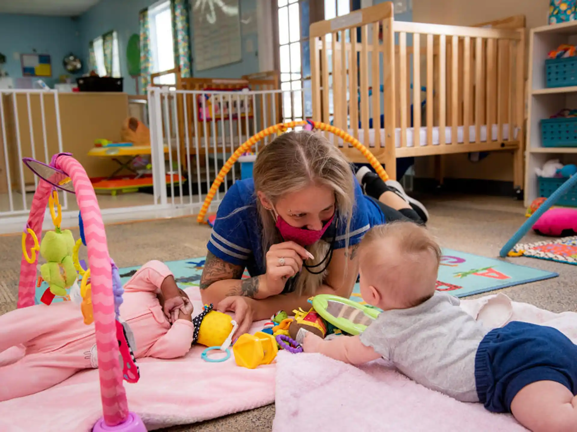 a baby and a baby playing