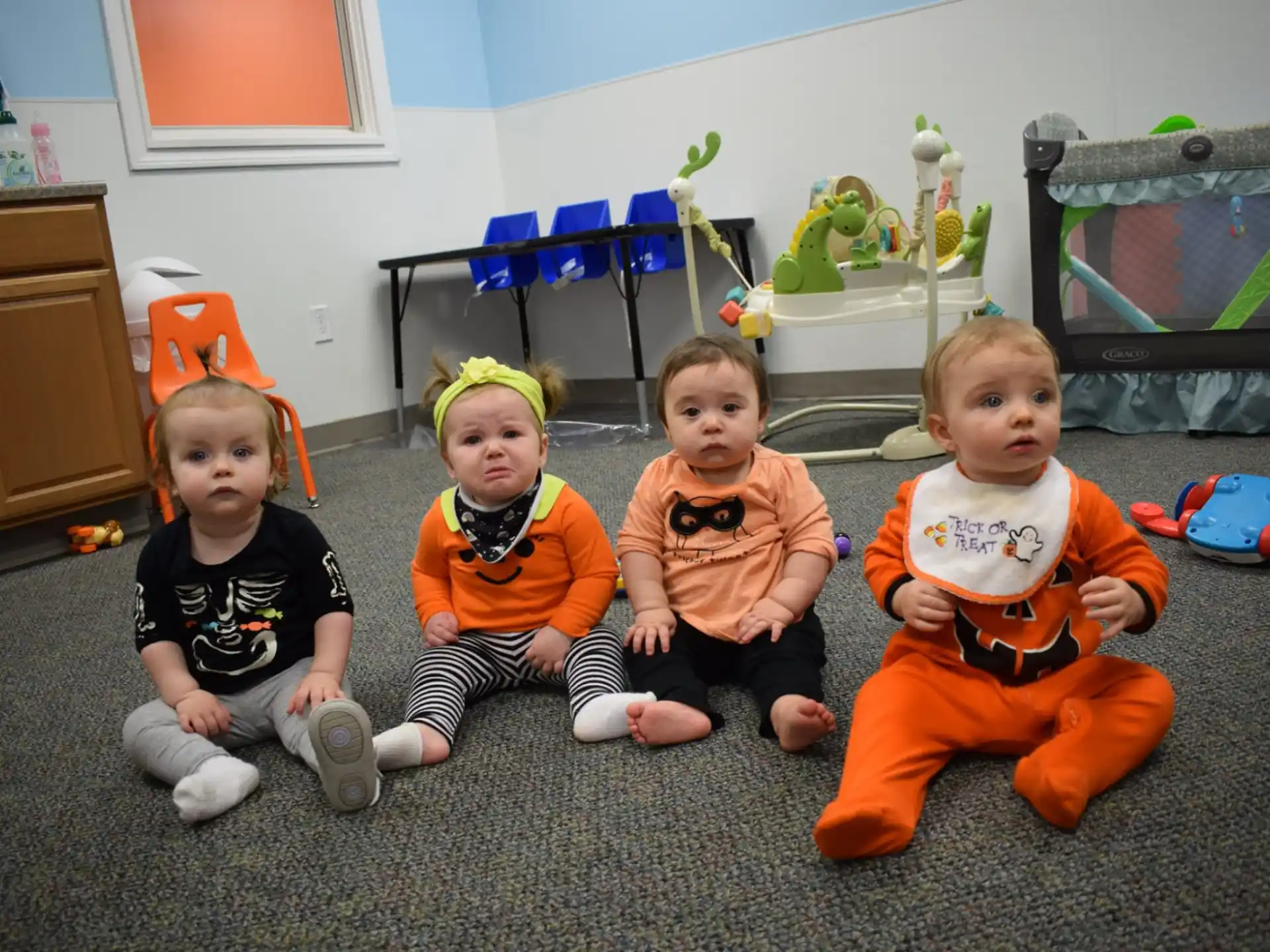 a group of children sitting on the floor