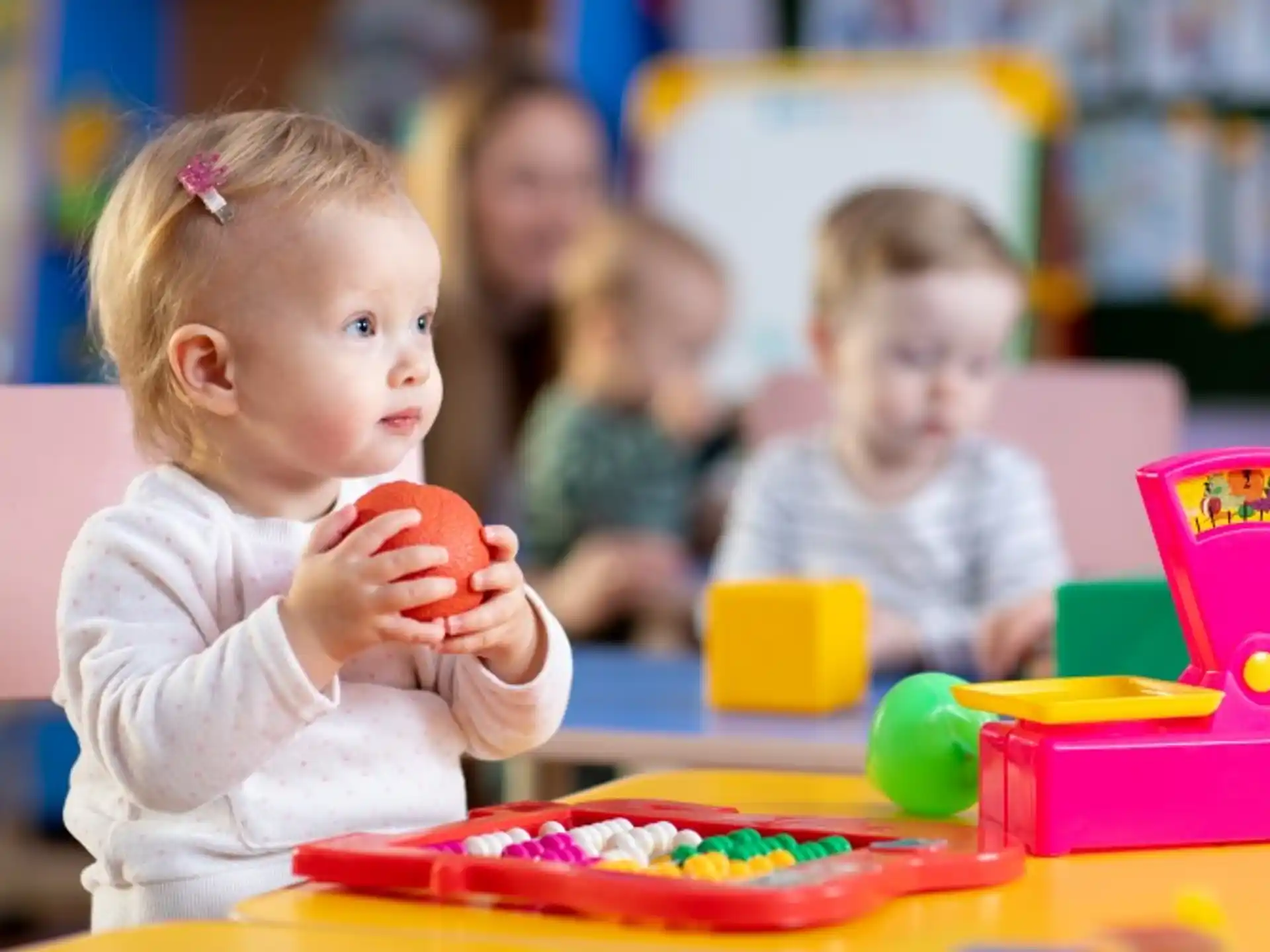 a baby playing with toys