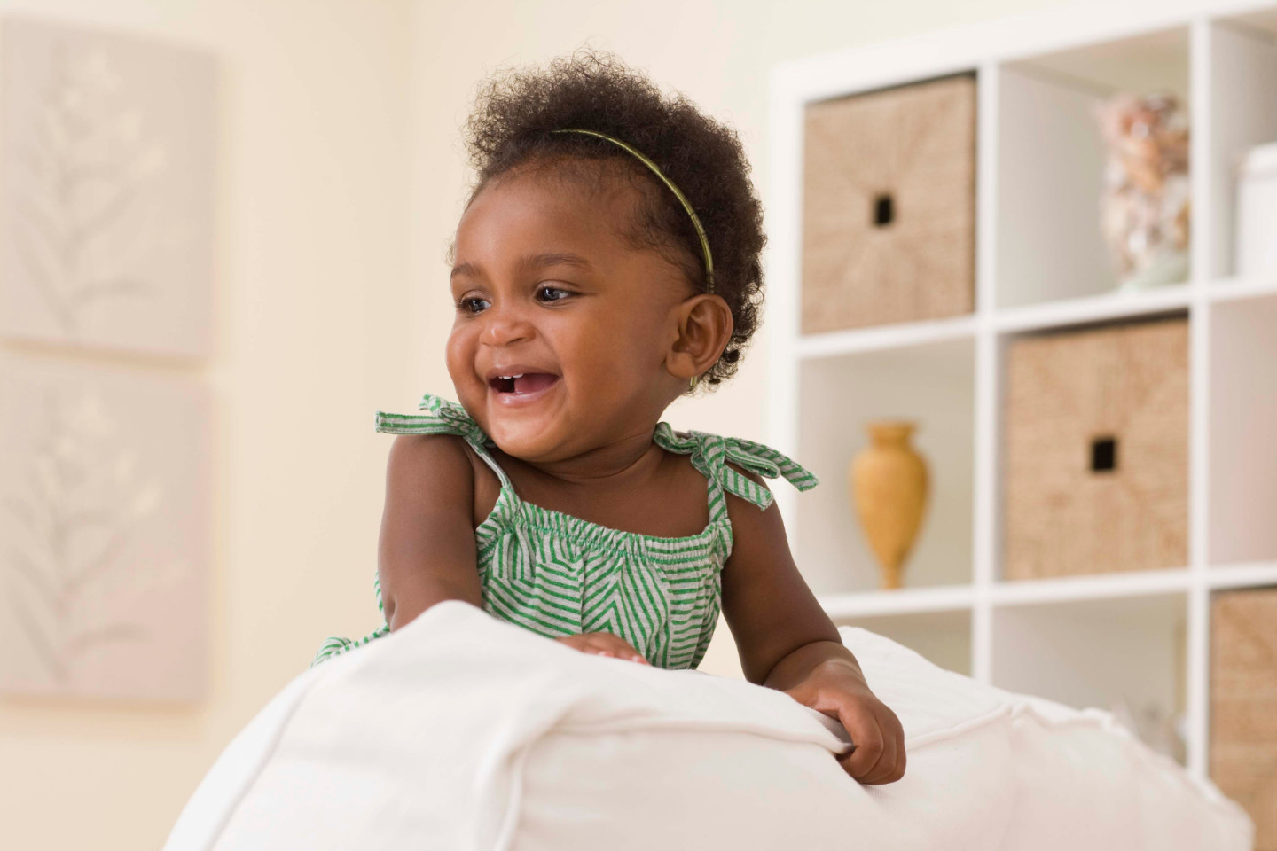 a baby in a green dress