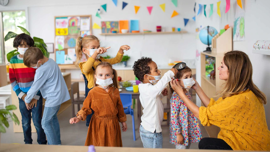 a group of children in a classroom