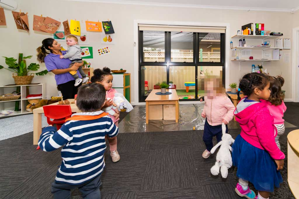 a group of children playing in a room