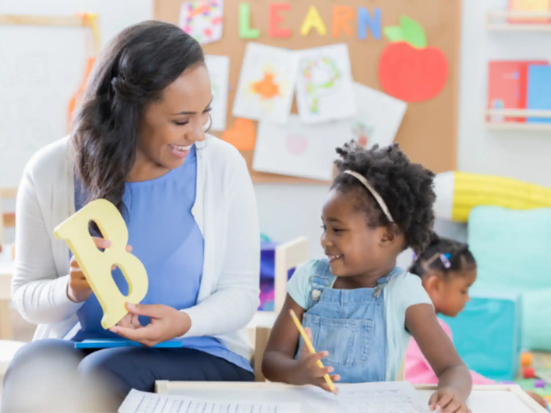 a person and a child looking at a paper