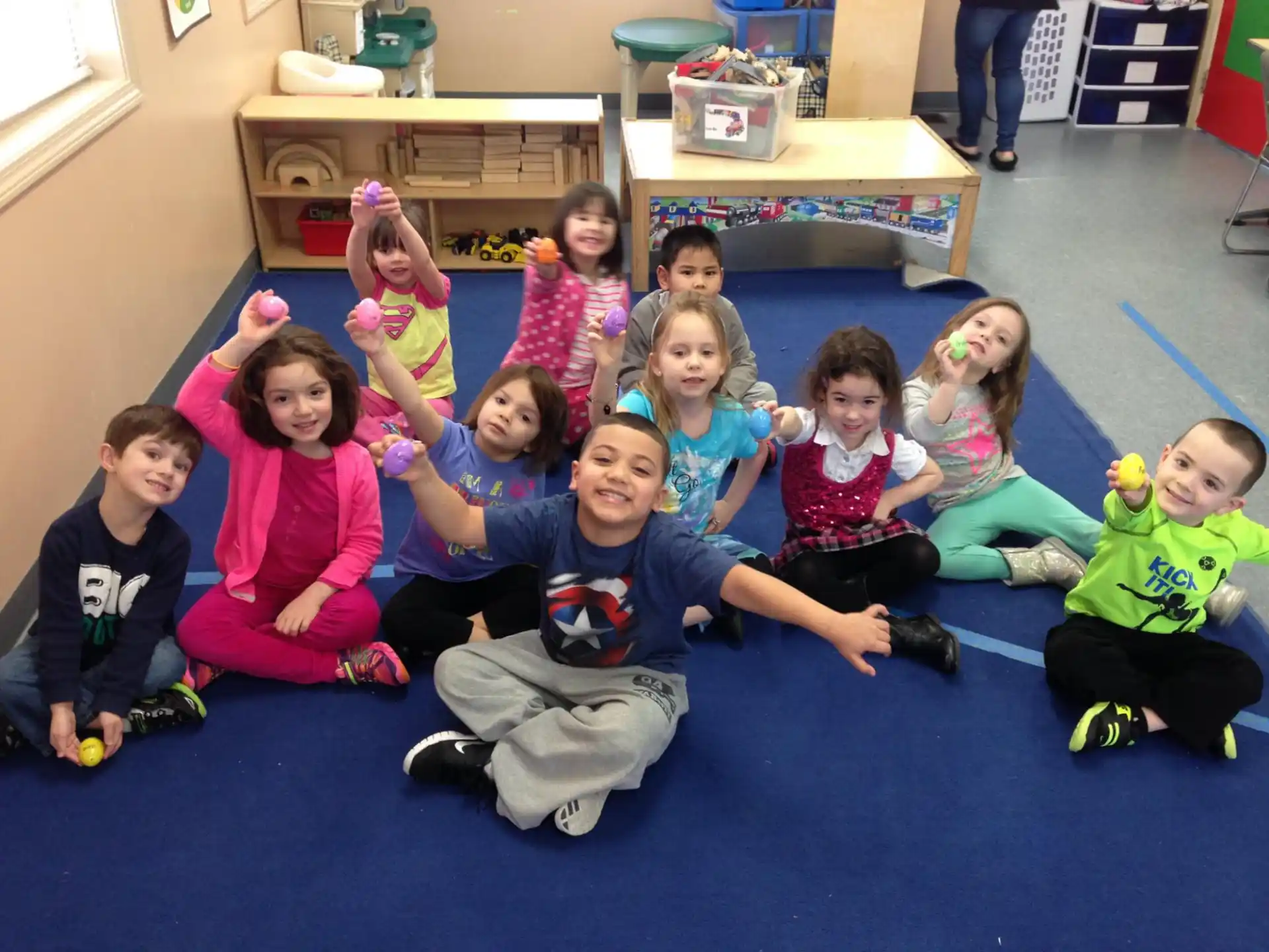 a group of children sitting on the floor