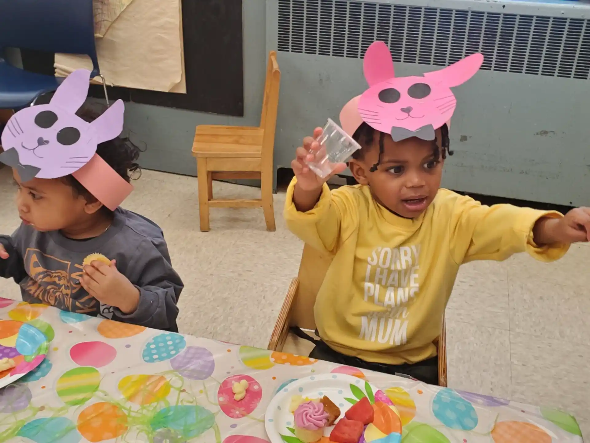 a couple of kids wearing party hats
